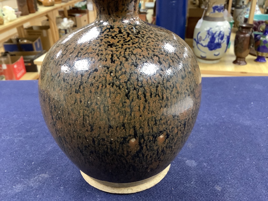 A Chinese blackware ribbed jar, a small blackware vase and a russet and black glazed jar, Yuan dynasty or later